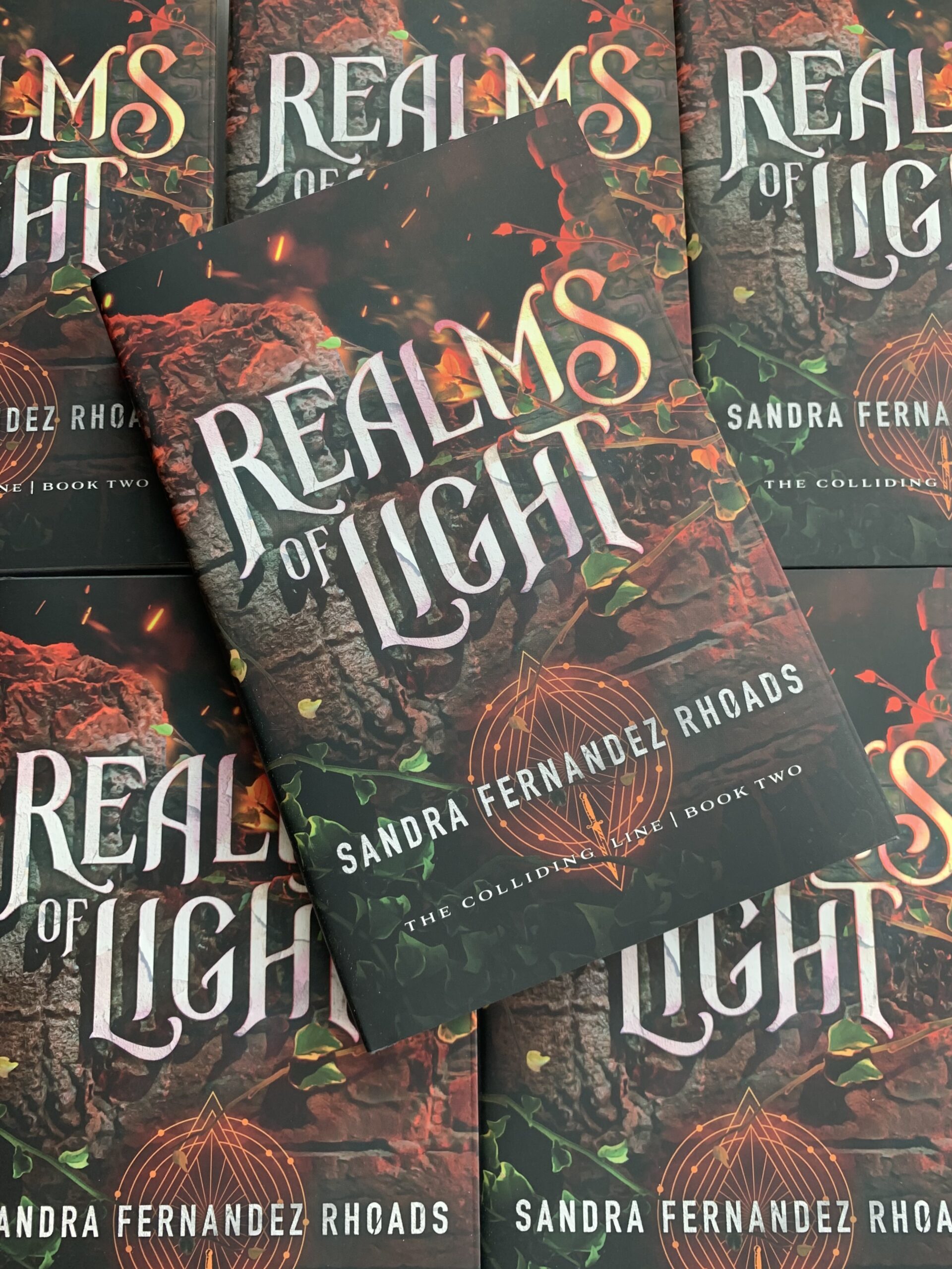 Angled Showcase of Realms of Light Media for Sandra Fernandez Rhoads Press Kit
